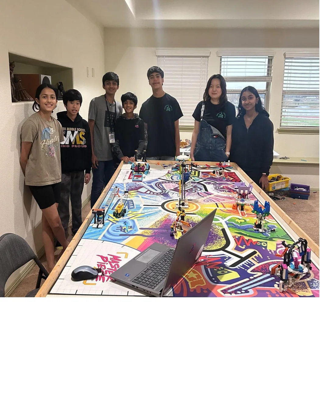 Mentoring younger robotics teams around an FLL playing field