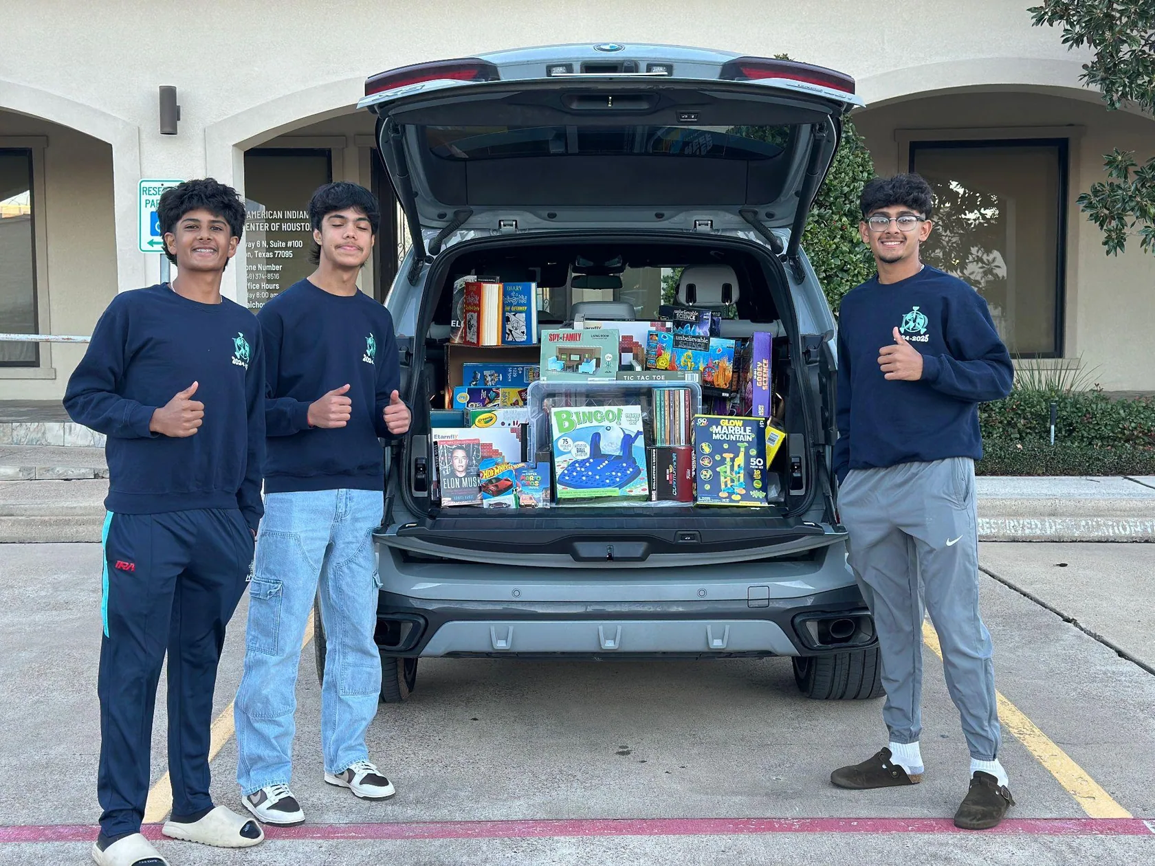 Dynamic Darts volunteers delivering donations