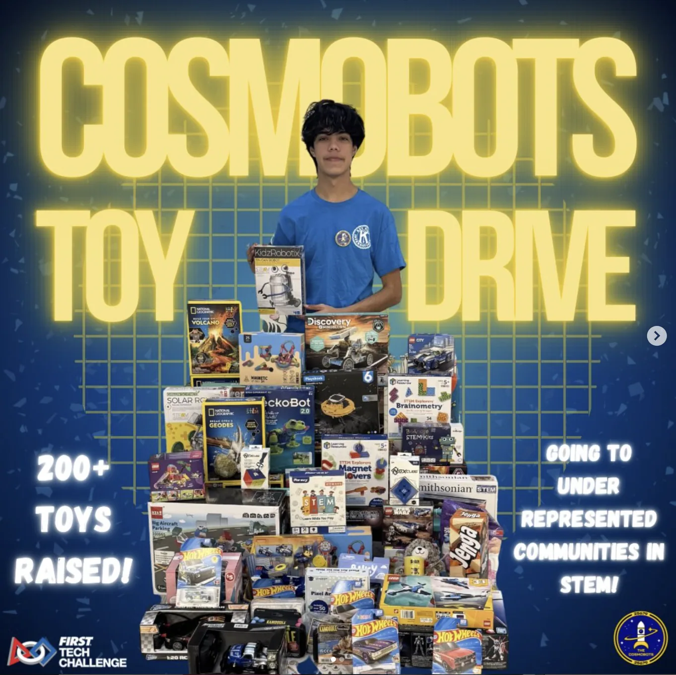 Robotics student with toys gathered for a toy drive